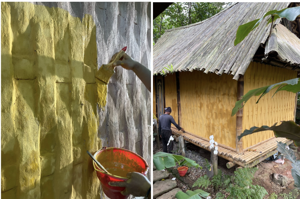 Applying the pigmented limewash over the lime plaster by using a brush.