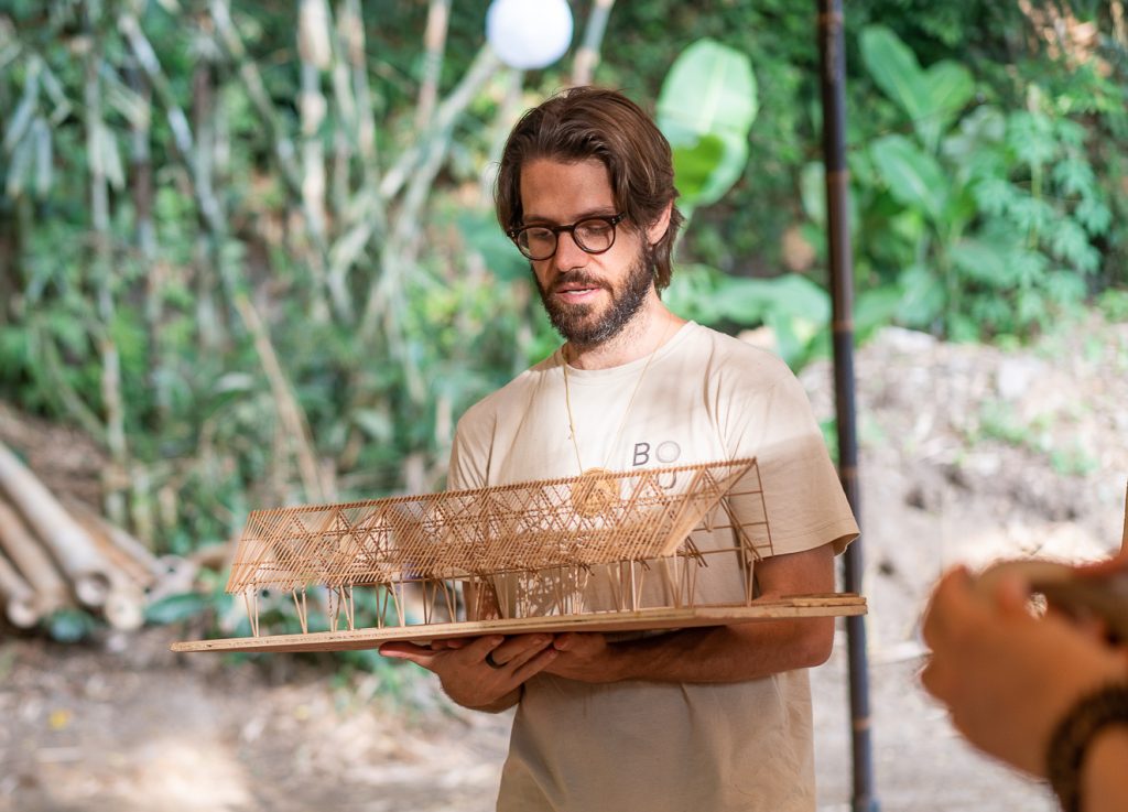 BAMBOO U - Orin Hardy Holding A Bamboo Model